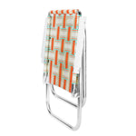 Folded orange and teal lawn chair in a geometric pattern on a white background