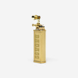Brass lighter with 'BADASS' engraving on a white background