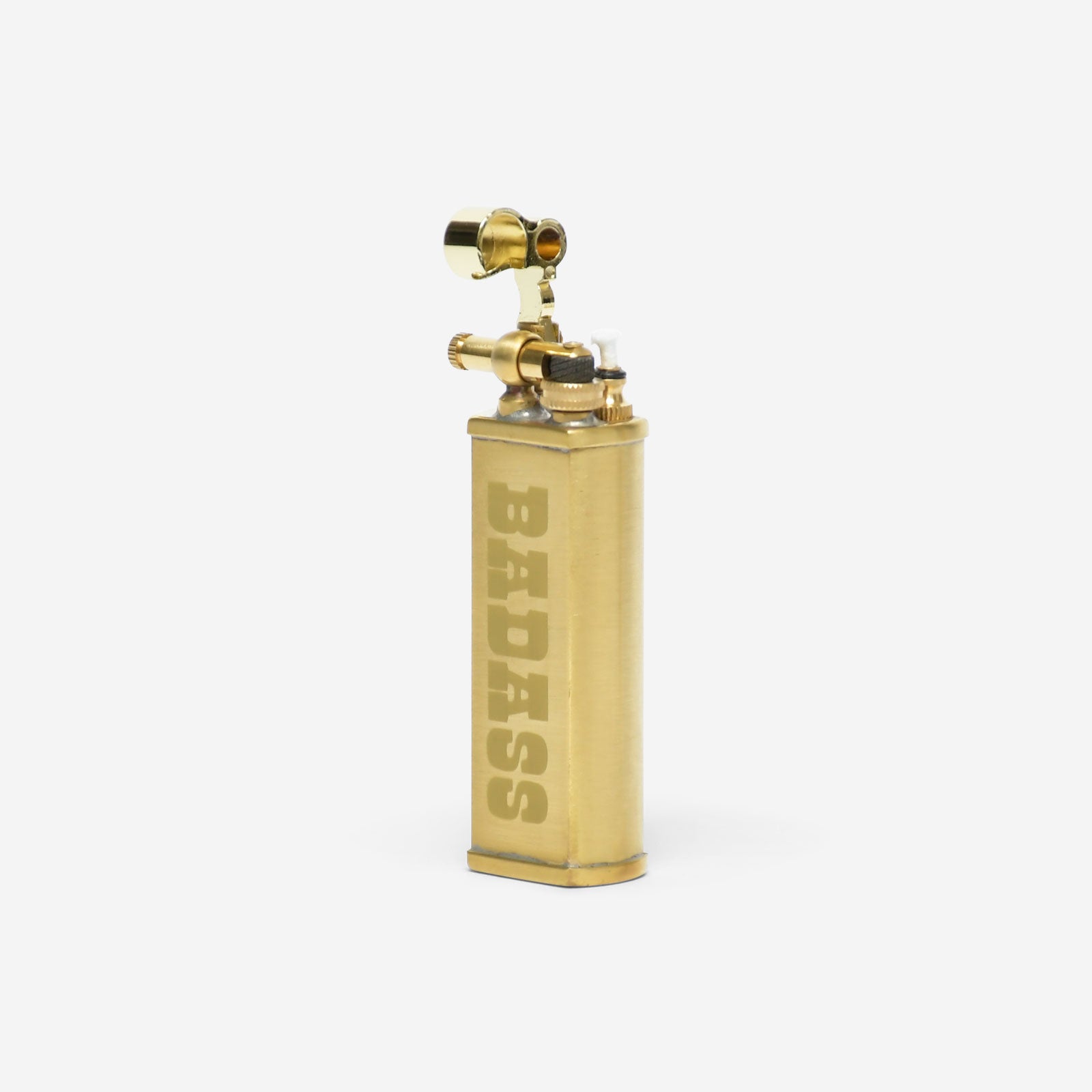 Brass lighter with 'BADASS' engraving on a white background