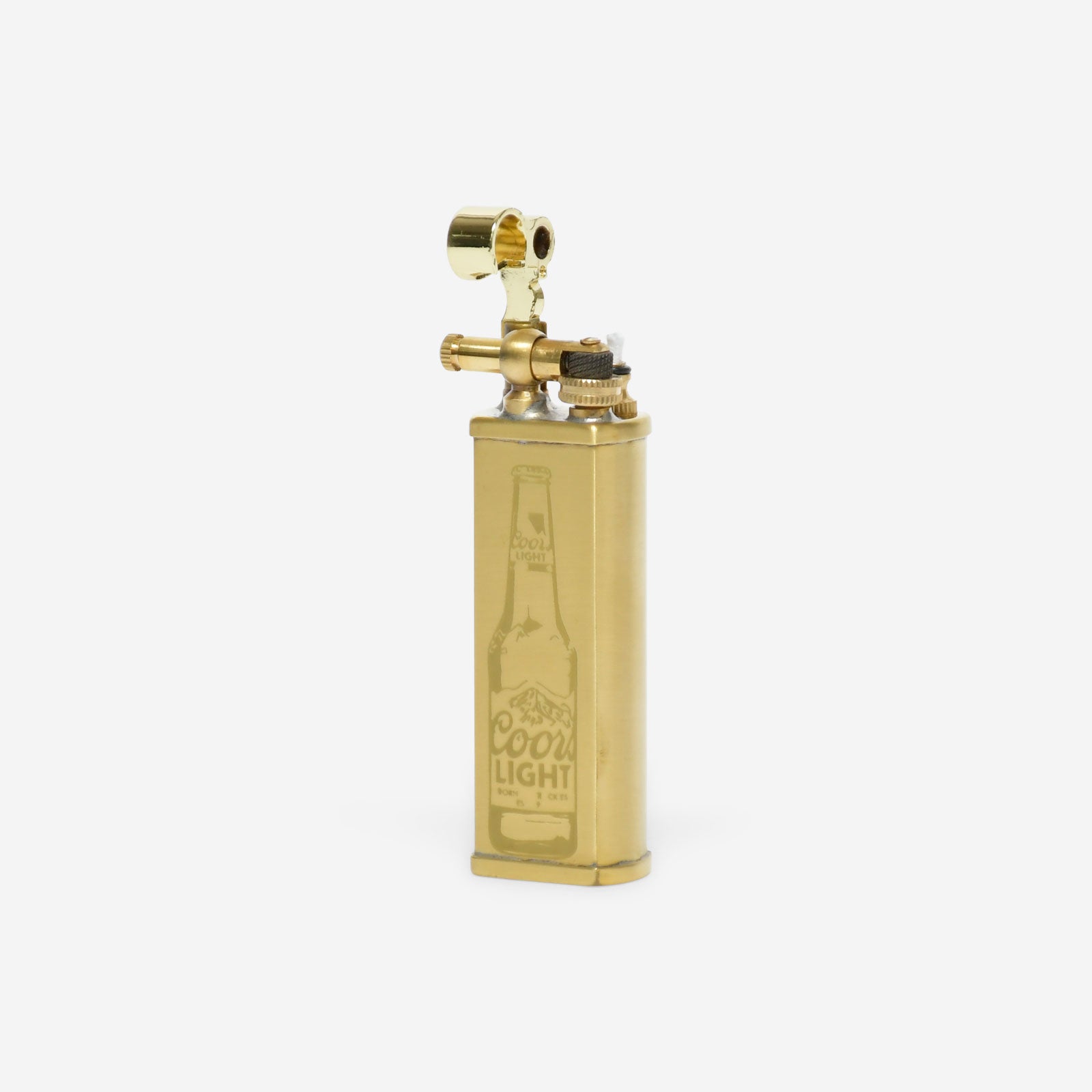Gold lighter with Coors Light bottle engraving on a white background