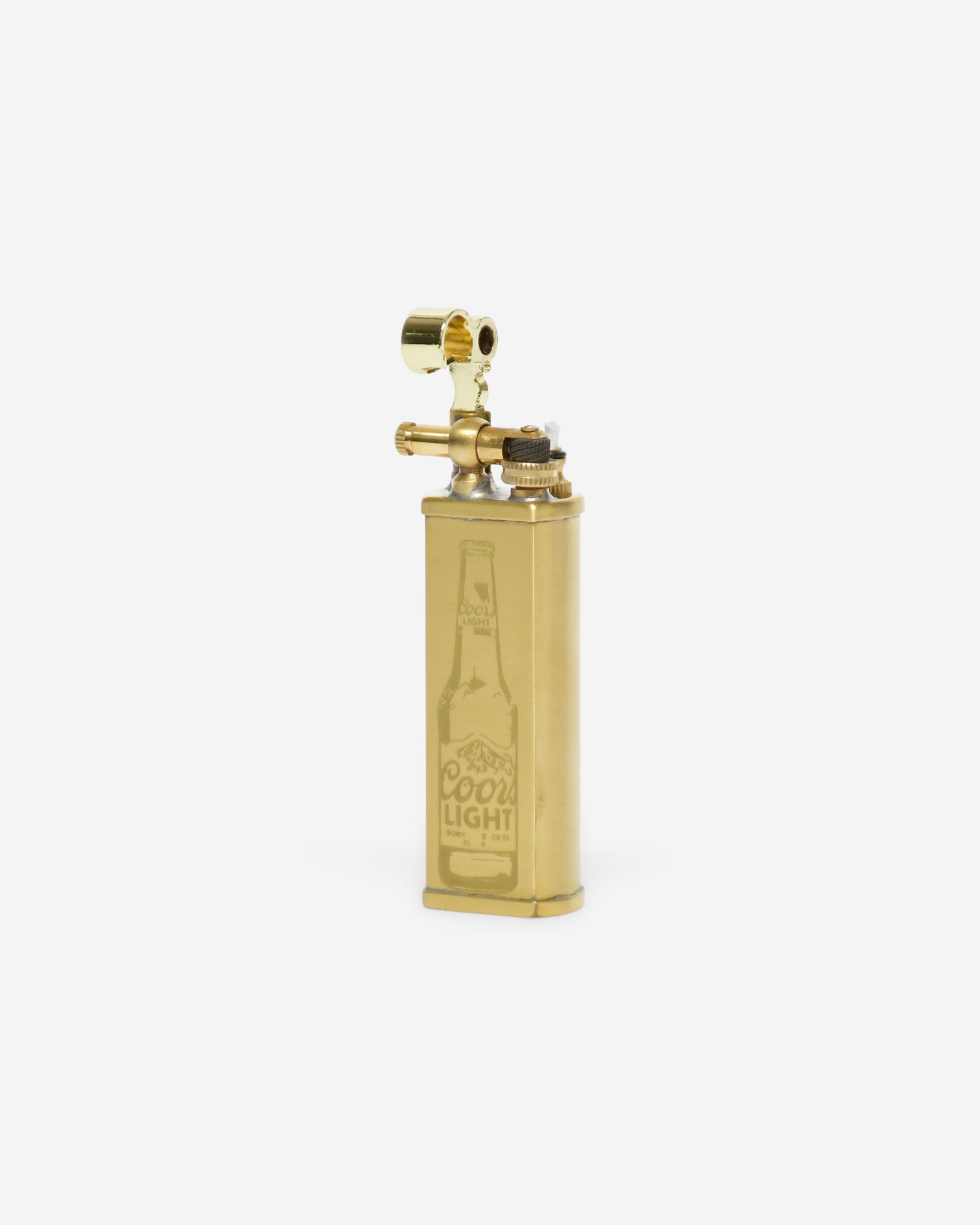 Gold lighter with Coors Light bottle engraving on a white background